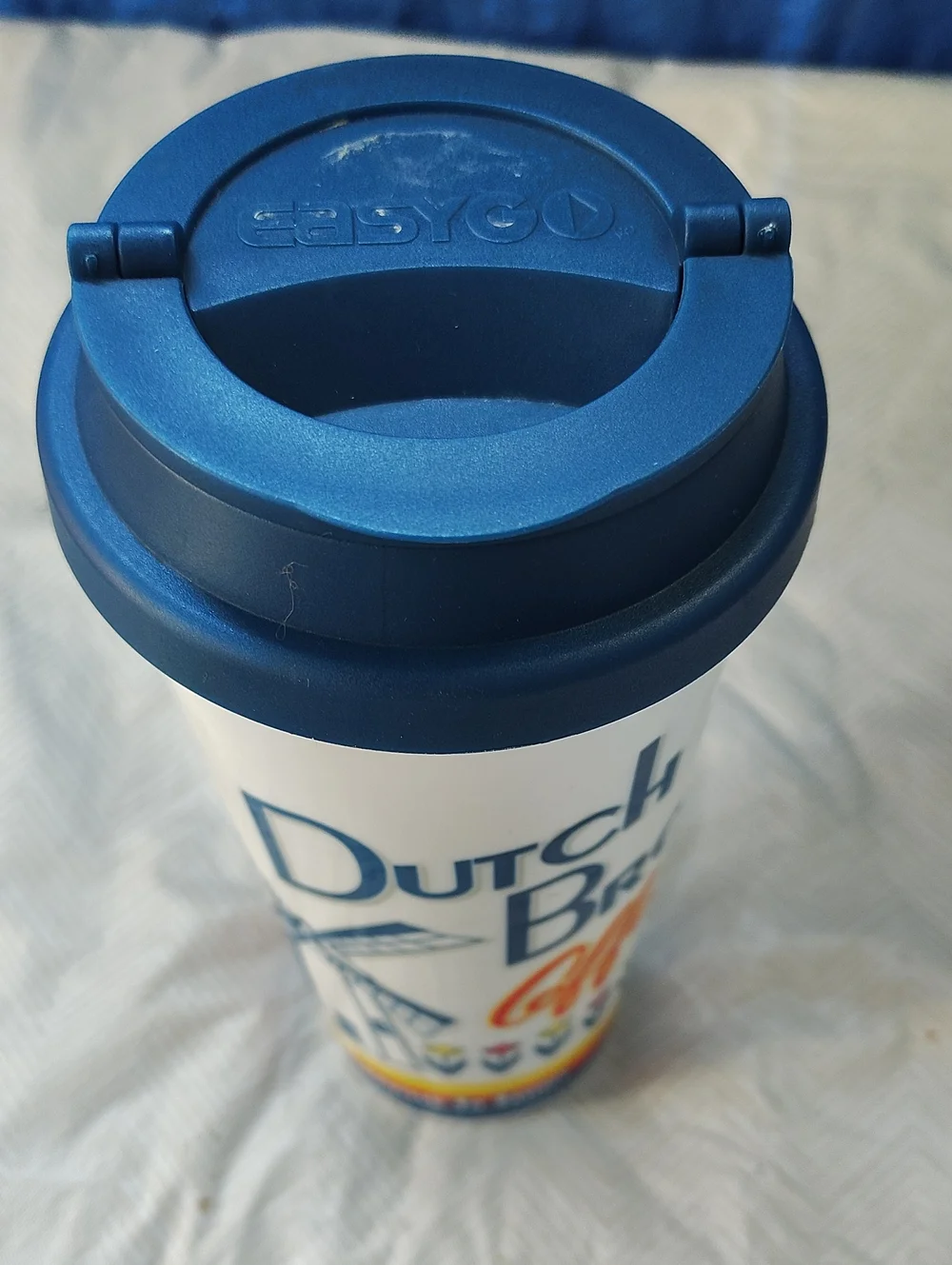 Dutch Bros White Travel Cup with Blue, Yellow & Red Accents